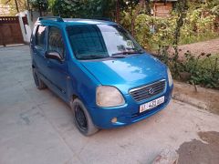 Photo of the vehicle Suzuki Wagon R+