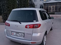 Фото авто Mazda Demio