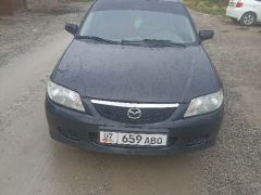 Сүрөт унаа Mazda 323