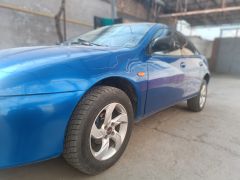 Сүрөт унаа Mazda 323