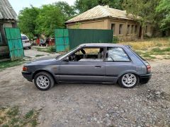 Сүрөт унаа Mazda 323