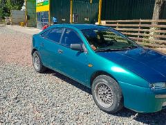 Photo of the vehicle Mazda 323