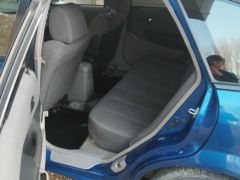 Сүрөт унаа Mazda 323