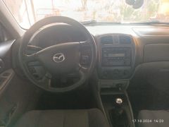 Сүрөт унаа Mazda 323