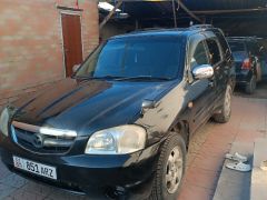 Photo of the vehicle Mazda Tribute