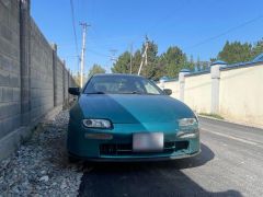 Сүрөт унаа Mazda 323