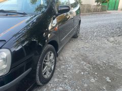 Фото авто Nissan Almera Tino