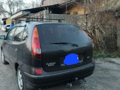 Фото авто Nissan Almera Tino