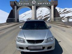 Сүрөт унаа Mazda 323