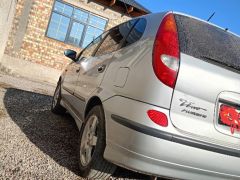 Фото авто Nissan Almera Tino