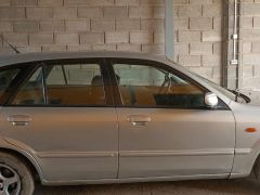 Сүрөт унаа Mazda 323