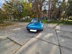 Сүрөт унаа Mazda 323