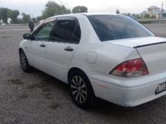 Фото авто Mitsubishi Lancer