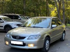 Сүрөт унаа Mazda 323