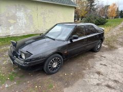 Сүрөт унаа Mazda 323