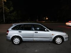 Сүрөт унаа Mazda 323