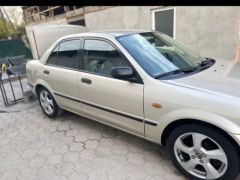 Сүрөт унаа Mazda 323