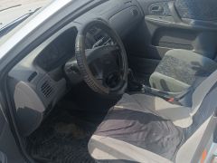 Сүрөт унаа Mazda 323