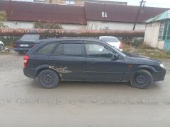 Сүрөт унаа Mazda 323