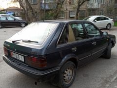 Сүрөт унаа Mazda 323