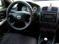 Сүрөт унаа Mazda 323