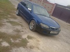 Фото авто Mazda Familia