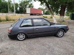 Сүрөт унаа Mazda 323