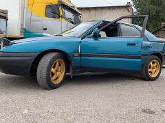 Сүрөт унаа Mazda 323