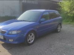 Фото авто Mazda 323