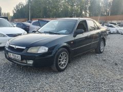 Сүрөт унаа Mazda 323