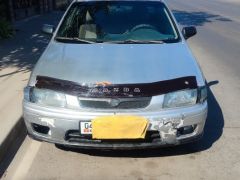 Сүрөт унаа Mazda 323