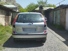 Фото авто Nissan Almera Tino