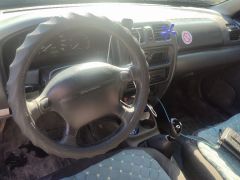 Photo of the vehicle Mazda 323