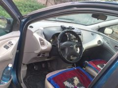 Фото авто Nissan Almera Tino