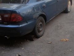 Сүрөт унаа Mazda 323