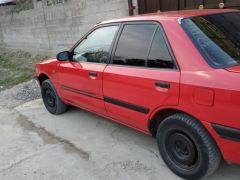 Сүрөт унаа Mazda 323