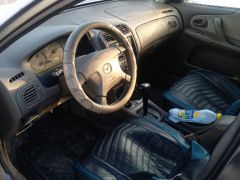 Сүрөт унаа Mazda 323