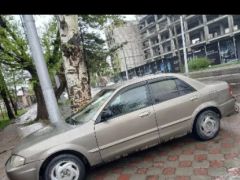 Сүрөт унаа Mazda 323