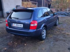 Сүрөт унаа Mazda 323