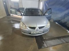 Фото авто Mitsubishi Lancer