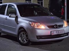 Photo of the vehicle Mazda Demio