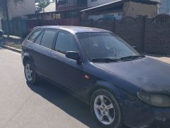 Сүрөт унаа Mazda 323