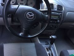 Photo of the vehicle Mazda 323