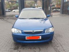 Сүрөт унаа Mazda 323