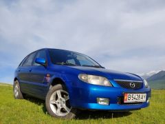 Сүрөт унаа Mazda 323