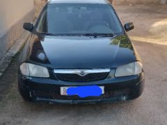 Сүрөт унаа Mazda 323