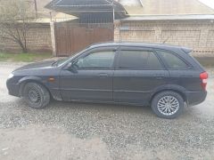 Сүрөт унаа Mazda 323