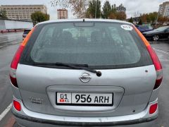 Фото авто Nissan Almera Tino