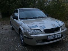 Сүрөт унаа Mazda 323