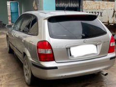 Сүрөт унаа Mazda 323